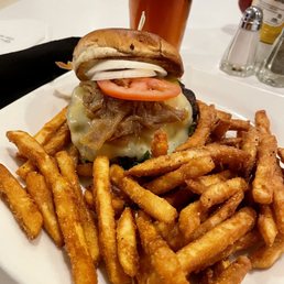 Burger with fries and Amber craft Pour.
