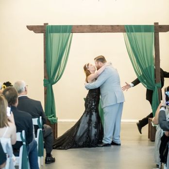 The Knot Tyer - Scott adding his special flair to our photos as he moves for us to have our first kiss! - Wedding Planning Near Me The Knot Tyer - Scott adding his special flair to our photos as he moves for us to have our first kiss! - Wedding Planning Near Me