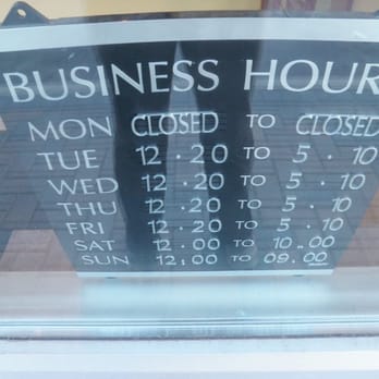Bollywood Bistro - a business hours sign in a window - Indian Near Me - Vaughan, Ontario Bollywood Bistro - a business hours sign in a window - Indian Near Me - Vaughan, Ontario