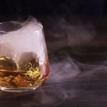Martini's On Main - The Martini Bar - smoke rising from the glass - Cocktail Bars Near Me - Biddeford, Maine