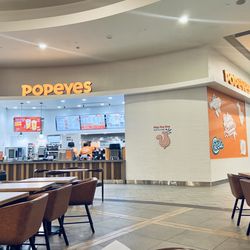 Located in the food court, by the parking lot entrance.
