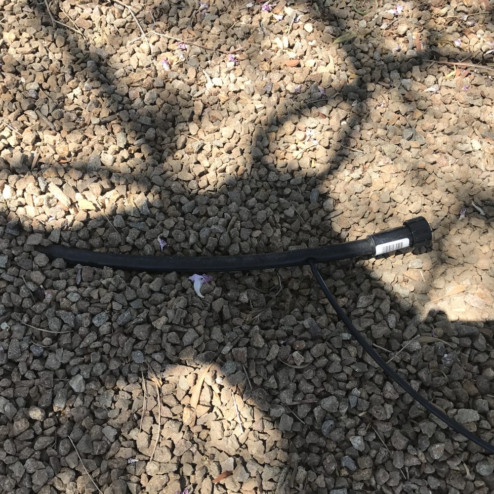 Earlybird Landscaping - a hose laying on the ground - Landscaping Near Me Earlybird Landscaping - a hose laying on the ground - Landscaping Near Me