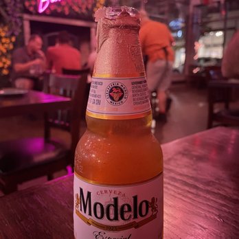 Barroco - a bottle of modelo beer on a table - Latin American Near Me - Westlake, Ohio Barroco - a bottle of modelo beer on a table - Latin American Near Me - Westlake, Ohio