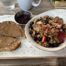 AM Superfoods Bowl with berry compote on the side. AM Superfoods Bowl with berry compote on the side.