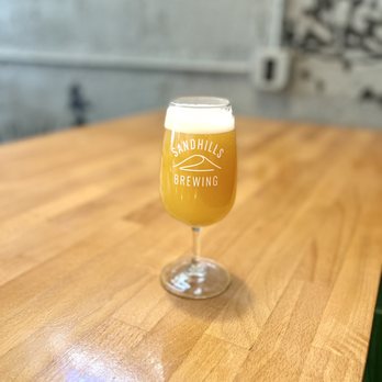 Sandhills Brewing - a glass of beer on a table - Breweries Near Me - Mission, Kansas Sandhills Brewing - a glass of beer on a table - Breweries Near Me - Mission, Kansas