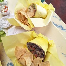 Veggie Burrito in foreground, shredded chicken burrito in background
