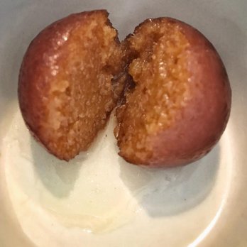 Tandoori Indian Cuisine - Gulab Jamun! Spongy milk balls in a surprisingly unique citrus(rose?) sugar syrup... Wow, these are amazing!!! - Indian Near Me - Spring, Texas Tandoori Indian Cuisine - Gulab Jamun! Spongy milk balls in a surprisingly unique citrus(rose?) sugar syrup... Wow, these are amazing!!! - Indian Near Me - Spring, Texas