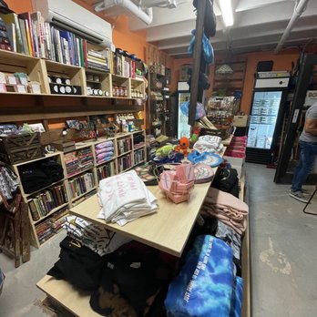 Booktanica - shelves of books and clothing in a store - Farmers Market Near Me - Miami, Florida