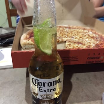 Little Ceasars - a bottle of corona extra with a slice of lime - Pizza Near Me - Chalmette, Louisiana Little Ceasars - a bottle of corona extra with a slice of lime - Pizza Near Me - Chalmette, Louisiana