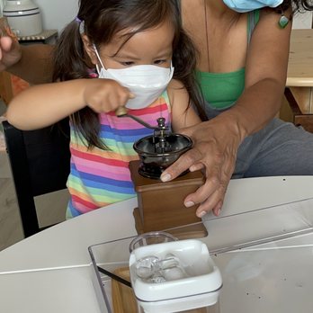 El Nido - Grinding coffee beans - Montessori Schools Near Me - Missouri City, Texas El Nido - Grinding coffee beans - Montessori Schools Near Me - Missouri City, Texas
