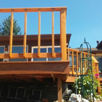 Express Tree Service and Landscaping - a wooden deck with railings - Tree Services Near Me