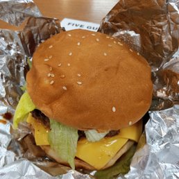 a hamburger wrapped in tin foil