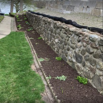Just-In-Time Outdoor Services - ows a stone retaining wall - Window Washing Near Me Just-In-Time Outdoor Services - ows a stone retaining wall - Window Washing Near Me