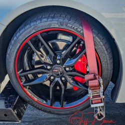 Exotic Luxury Auto Carriers - Securing the front tires to the tow trucks wheel lift system