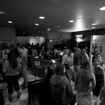 Volcanic Bottle Shoppe - a black and white photo of a group of people - Bars Near Me - Hood River, Oregon