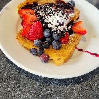 Peach Valley Cafè - French toast with strawberries  blueberries  and powdered sugar - Breakfast & Brunch Near Me - Gainesville, Florida