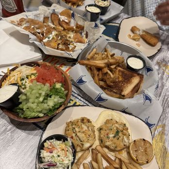 LandShark Bar & Grill - Crab cakes, loaded chip appetizer, side house salad, fish and chips. - Tiki Bars Near Me - Montgomery, Texas LandShark Bar & Grill - Crab cakes, loaded chip appetizer, side house salad, fish and chips. - Tiki Bars Near Me - Montgomery, Texas
