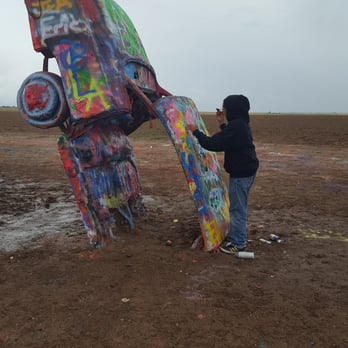 Cadillac Ranch - Cadillac Ranch on rainy day. I had mud caked on the bottom of my soles. Worth it, my son enjoyed his time here. - Landmarks & Historical Buildings Near Me - Amarillo, Texas Cadillac Ranch - Cadillac Ranch on rainy day. I had mud caked on the bottom of my soles. Worth it, my son enjoyed his time here. - Landmarks & Historical Buildings Near Me - Amarillo, Texas