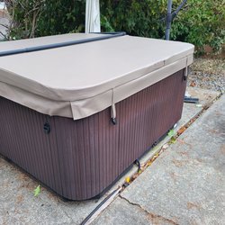 Aqua Quip - Tacoma / Lakewood - Clips on the side of the hot tub. They designed the cover with the clips in front.