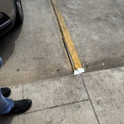 Firehouse Subs - Parking lot hazard with employee's foot