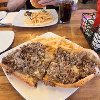 The Iron Oven - Cheesesteak with fried onions and french fries. - Bars Near Me - Southampton, Pennsylvania The Iron Oven - Cheesesteak with fried onions and french fries. - Bars Near Me - Southampton, Pennsylvania