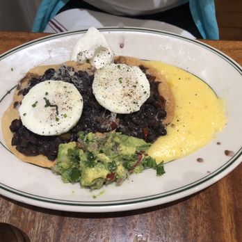 Willow Wood Market Cafe - Huevos Rancheros, made with poached eggs, black beans, creamy, polenta, and spicy avocado salsa. Yummm - Breakfast & Brunch Near Me - Graton, California