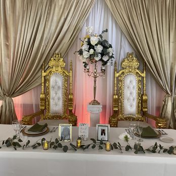 Elegant Events By Andrea - Our rentals included throne chairs, table decor, floral arrangements, backdrop and uplighting. - Venues & Event Spaces Near Me Elegant Events By Andrea - Our rentals included throne chairs, table decor, floral arrangements, backdrop and uplighting. - Venues & Event Spaces Near Me