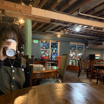 Bennu Coffee - a woman drinking a cup of coffee - Coffee & Tea Near Me - Austin, Texas Bennu Coffee - a woman drinking a cup of coffee - Coffee & Tea Near Me - Austin, Texas