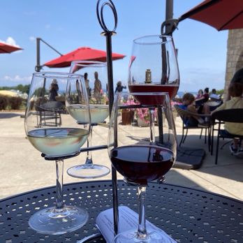 Mari Vineyards - Our flight while sitting on the patio, view of the bay in the distance - Wine Tasting Room Near Me - Traverse City, Michigan Mari Vineyards - Our flight while sitting on the patio, view of the bay in the distance - Wine Tasting Room Near Me - Traverse City, Michigan