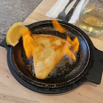Colossus Greek Taverna - Saganaki (flambé table side) - Greek Near Me - Oakville, Ontario Colossus Greek Taverna - Saganaki (flambé table side) - Greek Near Me - Oakville, Ontario