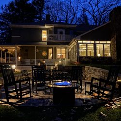 Andon-Reid Inn Bed and Breakfast - Outdoor fire pit at night in front of rocking chairs