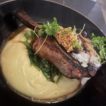 Craft Tampa - 24-HOUR BRINED BONE-IN PORK CHOP Pommes Purée, Dijon Gruyere Mornay, Kale, Wild Mushroom, Pickled Mustard Seed - American Near Me - Tampa Bay, Florida Craft Tampa - 24-HOUR BRINED BONE-IN PORK CHOP Pommes Purée, Dijon Gruyere Mornay, Kale, Wild Mushroom, Pickled Mustard Seed - American Near Me - Tampa Bay, Florida