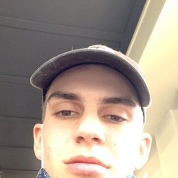 a man with a bandana around his neck