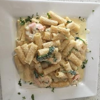 Dona Neli - a plate of pasta with ham and broccoli - Mediterranean Near Me - Miami, Florida