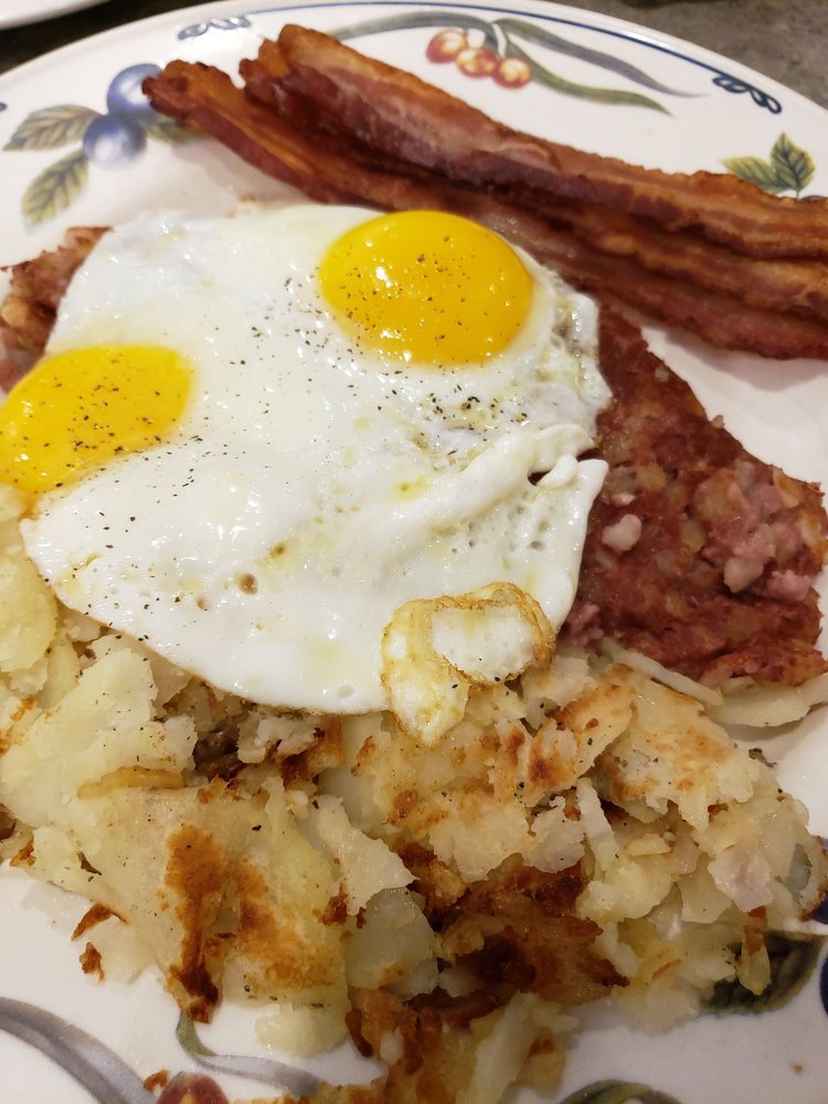 Corned beef hash, 2 eggs sunnyside up, hashbrowns, toast, and bacon. Yelp