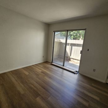 Carpet Club - empty living room with sliding glass door - Carpeting Near Me - Escondido, California Carpet Club - empty living room with sliding glass door - Carpeting Near Me - Escondido, California