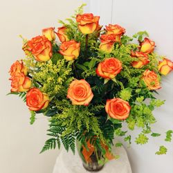 Brea Florist - Two dozen by fall orange bi colored roses.