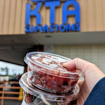 KTA Super Stores - a hand holding a bowl of fruit - Grocery Near Me - Hilo, Hawaii