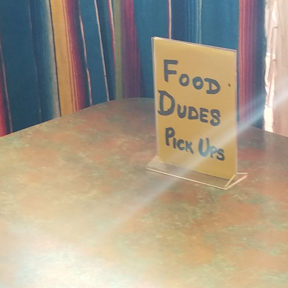 Bravo Burrito - a table with a sign on it - Mexican Near Me - Saint Cloud, Minnesota