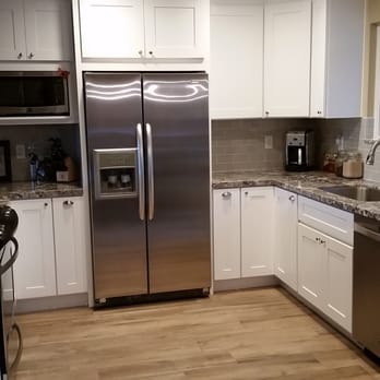 Charmet Tile - a clean kitchen with stainless steel appliances - Flooring Near Me - San Diego, California