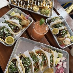 Tacos de chicharrón and asad fries Tacos de chicharrón and asad fries