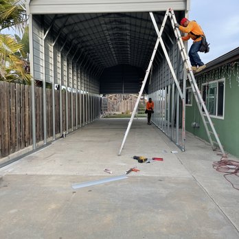 United Carports - a man on a ladder working on a carport - General Contractors Near Me - Perris, California United Carports - a man on a ladder working on a carport - General Contractors Near Me - Perris, California