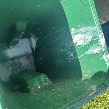 All Damage Restoration - Dirty trash can where the workers washed out their supplies - Damage Restoration Near Me - Margate, Florida