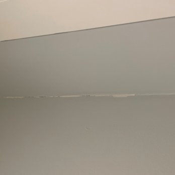 Chitown Tile - Cracking dry wall on the wall outside of the bathroom - Handyman Near Me