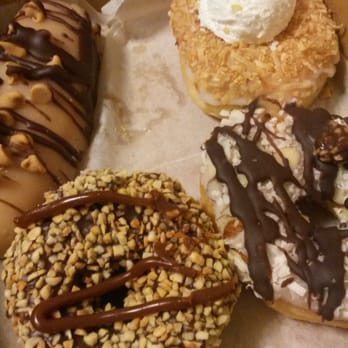 Nicola's Donuts - Reeses long john, coconut cream, snickers and almond joy - Donuts Near Me - Tampa, Florida Nicola's Donuts - Reeses long john, coconut cream, snickers and almond joy - Donuts Near Me - Tampa, Florida