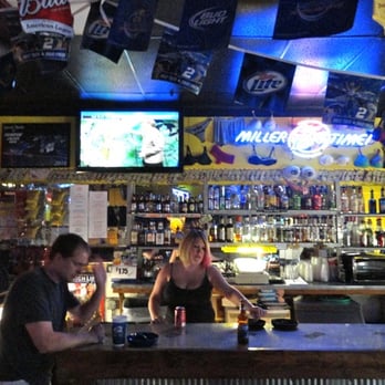 Jumpin Jacks Bar - two people at the bar - Dive Bars Near Me - Saint Joseph, Missouri