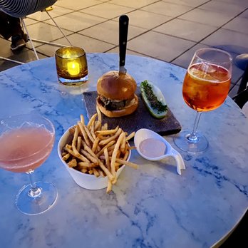 Westlight - North fork royale cocktail and fries on the left. - Tapas/Small Plates Near Me - Brooklyn, New York