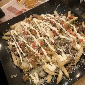 The Lounge - Carne asada loaded fries. - Cocktail Bars Near Me - Brentwood, California The Lounge - Carne asada loaded fries. - Cocktail Bars Near Me - Brentwood, California