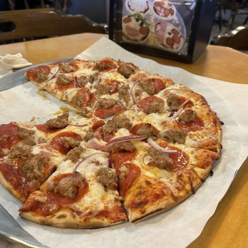 Mendi's Pizza - a half eaten pizza and a beer - Pizza Near Me - Independence, Oregon Mendi's Pizza - a half eaten pizza and a beer - Pizza Near Me - Independence, Oregon