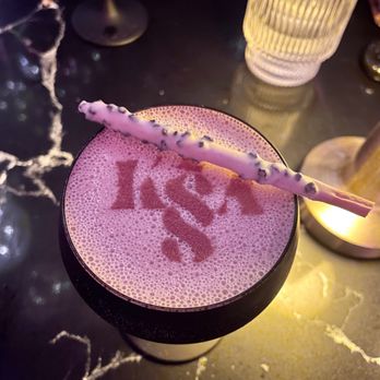 Kissa - a purple drink with a straw in it - Lounges Near Me - Toronto, Ontario